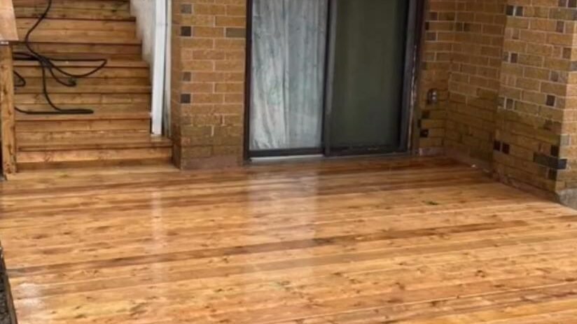 Custom wood deck with stairs and railing in Brampton